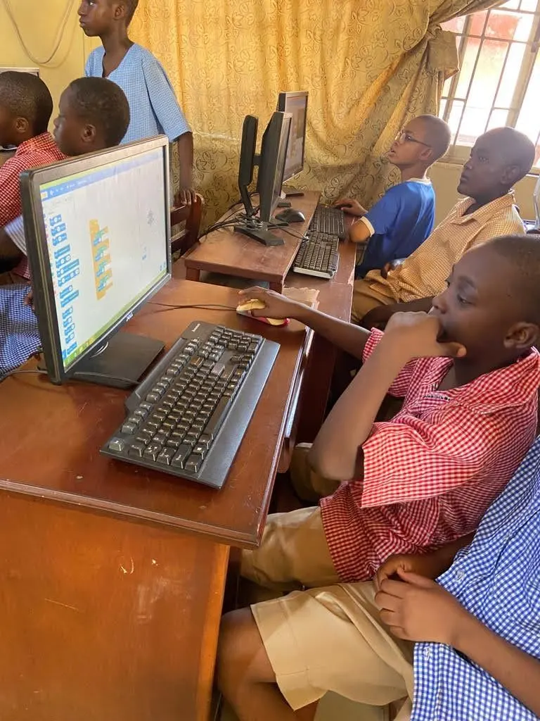 Students at desktop computers during a coding class