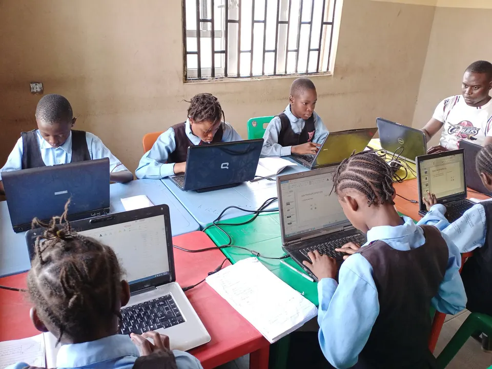 Pupils working at laptops in a Techbase coding class